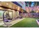 Cozy patio featuring comfortable seating, lush greenery, and stylish outdoor furniture, great for entertaining at 1181 Calle De Luz, Henderson, NV 89012