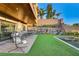 Inviting patio with stylish seating, perfect for outdoor entertaining, overlooks a well-maintained lawn and pool at 1181 Calle De Luz, Henderson, NV 89012