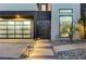 Stylish front walkway with elegant lighting leading to the modern home entrance at 1181 Calle De Luz, Henderson, NV 89012