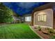 Lush green backyard with manicured lawn and tasteful landscaping, offering a serene outdoor space at 12 Kennesaw Rd, Henderson, NV 89052