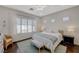 Comfortable bedroom with hardwood floors, natural light, and a ceiling fan at 12 Kennesaw Rd, Henderson, NV 89052