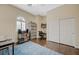 Bedroom with wood floors, large window with white shutters, and large closet at 12 Kennesaw Rd, Henderson, NV 89052