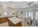 Bright dining area with a ceiling fan and plantation shutters, offering a sunny atmosphere at 12 Kennesaw Rd, Henderson, NV 89052
