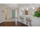 Inviting entryway featuring a light blue front door and a breakfast bar with pendant lighting at 12 Kennesaw Rd, Henderson, NV 89052