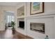 Elegant fireplace with decorative shelving and a view into the adjacent office space at 12 Kennesaw Rd, Henderson, NV 89052