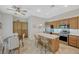 Well-equipped kitchen with stainless steel appliances, center island, and ample cabinet space at 12 Kennesaw Rd, Henderson, NV 89052