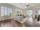 Bright living room with hardwood floors, plantation shutters, and sliding doors to the patio at 12 Kennesaw Rd, Henderson, NV 89052