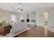 Inviting living room featuring a cozy fireplace, hardwood floors, and sliding glass doors at 12 Kennesaw Rd, Henderson, NV 89052