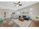 Spacious living room with hardwood floors, recessed lighting, and large windows with plantation shutters at 12 Kennesaw Rd, Henderson, NV 89052