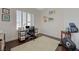 Bright home office with a large window, plantation shutters, and a work desk at 12 Kennesaw Rd, Henderson, NV 89052