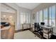 Comfortable home office with ample natural light and an adjacent living area at 12 Kennesaw Rd, Henderson, NV 89052