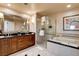 Elegant bathroom featuring dual vanities, glass shower, and soaking tub at 145 E Harmon Ave # 3807, Las Vegas, NV 89109