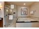 Bright bathroom with a glass-enclosed shower and a luxurious soaking tub at 145 E Harmon Ave # 3807, Las Vegas, NV 89109