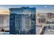 Exterior shot of Hilton Grand Vacations building with glass facade reflecting city skyline at 145 E Harmon Ave # 3807, Las Vegas, NV 89109