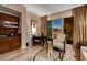 This inviting living room includes a kitchenette, comfortable seating, and beautiful city views at 145 E Harmon Ave # 3807, Las Vegas, NV 89109