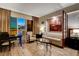 Bright living room with a comfortable sofa, a glass coffee table, and views of the city skyline at 145 E Harmon Ave # 3807, Las Vegas, NV 89109