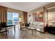 Bright living room with modern furniture and a large window with city views at 145 E Harmon Ave # 3807, Las Vegas, NV 89109