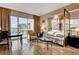 Bright living room with modern furniture and a large window with city views at 145 E Harmon Ave # 3807, Las Vegas, NV 89109