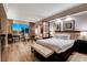 Inviting main bedroom featuring a king bed, a sitting area, and breathtaking city views at 145 E Harmon Ave # 3807, Las Vegas, NV 89109