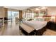 Well-lit main bedroom featuring a king bed, sitting area, and scenic city views at 145 E Harmon Ave # 3807, Las Vegas, NV 89109