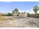 Picture of the home's backyard featuring a storage shed, palm tree and open space at 1718 Marlin Ave, Las Vegas, NV 89101
