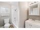 Clean bathroom featuring white tiled shower over tub, vanity, and tile floors at 1718 Marlin Ave, Las Vegas, NV 89101