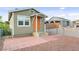 Charming single-story house with orange front door and a small brick landing at 1718 Marlin Ave, Las Vegas, NV 89101