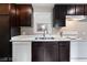 Bright kitchen featuring stainless steel sink, white appliances, and dark cabinetry at 1718 Marlin Ave, Las Vegas, NV 89101