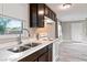 Bright kitchen featuring stainless steel sink, white appliances, and hard surface floors at 1718 Marlin Ave, Las Vegas, NV 89101