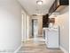 Modern kitchen featuring stainless steel sink, white appliances, and hard surface floors at 1718 Marlin Ave, Las Vegas, NV 89101
