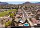 Expansive aerial view of a neighborhood showcasing well-maintained homes and desert landscaping with mountain views at 190 Channel Dr, Henderson, NV 89002