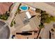 This aerial view showcases a home with a private backyard pool, lush landscaping, and a multi-car driveway at 190 Channel Dr, Henderson, NV 89002