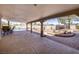 Spacious covered patio with pool and landscaped yard, perfect for outdoor entertaining at 190 Channel Dr, Henderson, NV 89002