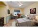 Comfortable bedroom with ample natural light, a stylish desk, and tasteful decor at 190 Channel Dr, Henderson, NV 89002