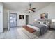 Well-lit bedroom featuring a comfy bed, stylish artwork, and access to the outdoor patio at 190 Channel Dr, Henderson, NV 89002