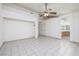 Spacious primary bedroom features neutral walls and tile floors with view of the bathroom at 190 Channel Dr, Henderson, NV 89002