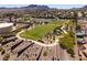 Overhead view of community park, walking trail and landscaping in a neighborhood with mountain views at 190 Channel Dr, Henderson, NV 89002
