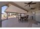 Covered patio with ceiling fans and outdoor dining furniture, perfect for entertaining at 190 Channel Dr, Henderson, NV 89002