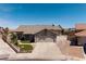 Charming single-story home featuring a well-manicured lawn, large driveway, and a two-car garage at 190 Channel Dr, Henderson, NV 89002