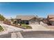 Charming single-story home with a well-manicured lawn, mature plants and an ample driveway at 190 Channel Dr, Henderson, NV 89002