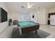 Bright game room featuring a billiard table, large windows, and tile flooring at 190 Channel Dr, Henderson, NV 89002