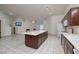 Open floor plan showcasing the kitchen island with cabinets and view of the great room at 190 Channel Dr, Henderson, NV 89002