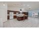 Open kitchen features tile flooring, stainless steel appliances, breakfast bar, and recessed lighting at 190 Channel Dr, Henderson, NV 89002