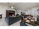Open-concept living area with a fireplace, dining space, and a view of the kitchen at 190 Channel Dr, Henderson, NV 89002