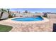 Inviting in-ground pool surrounded by decorative paving and a lushly landscaped backyard at 190 Channel Dr, Henderson, NV 89002