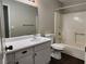 Bathroom with a shower-tub combo, single sink vanity with white cabinets, and gray walls at 2020 Mesquite Ln # 205, Laughlin, NV 89029