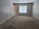 Spacious bedroom with neutral carpeting, and a bright window offering natural light at 2020 Mesquite Ln # 205, Laughlin, NV 89029