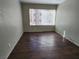 Empty bedroom showcasing wood-look floors and a large window with plenty of natural light at 2020 Mesquite Ln # 205, Laughlin, NV 89029