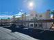 Low angle exterior showcasing covered parking with palm trees in a well maintained community at 2020 Mesquite Ln # 205, Laughlin, NV 89029