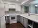 Bright kitchen featuring white appliances, ample counter space and wood look flooring at 2020 Mesquite Ln # 205, Laughlin, NV 89029